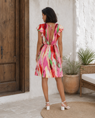 Robe courte dos ouvert en coton imprimé