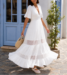     Robe longue blanche en viscose avec décolleté V, dos ouvert noué et incrustations en dentelle macramé