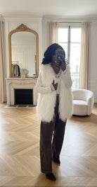 gilet fausse fourrure blanc femme, gilet sans manches hiver, veste fourrure femme chic, gilet blanc fourré, gilet hiver femme tendance, gilet cosy fausse fourrure